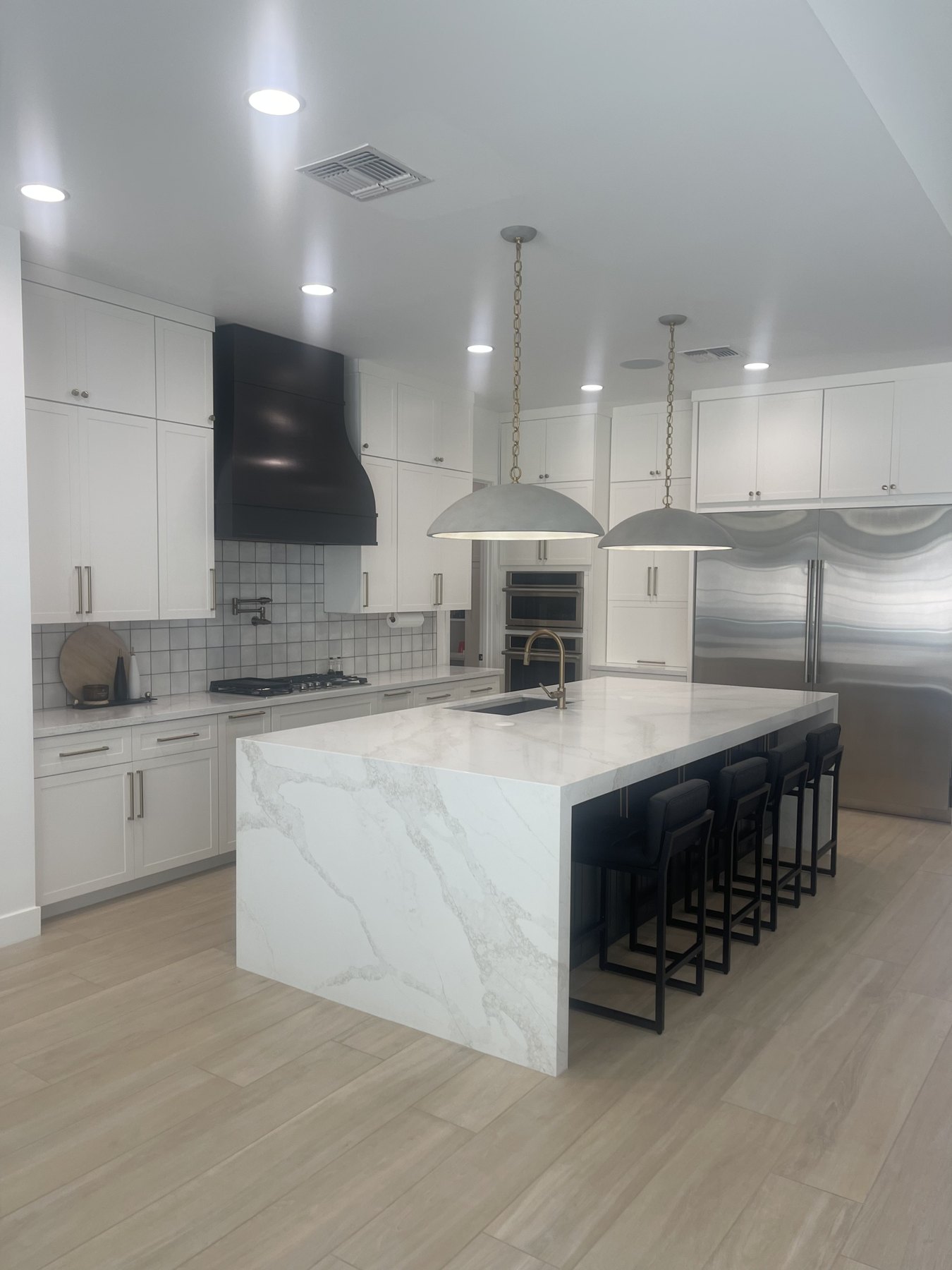 Completed custom kitchen with warm wood cabinetry by Saguaro Cabinetry