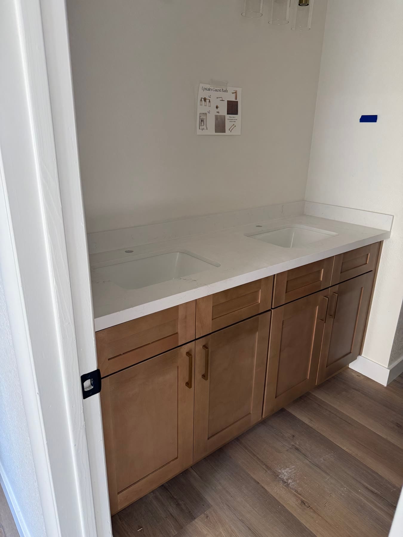 Natural-wood double-sink vanity with quartz countertop and undermount sinks
