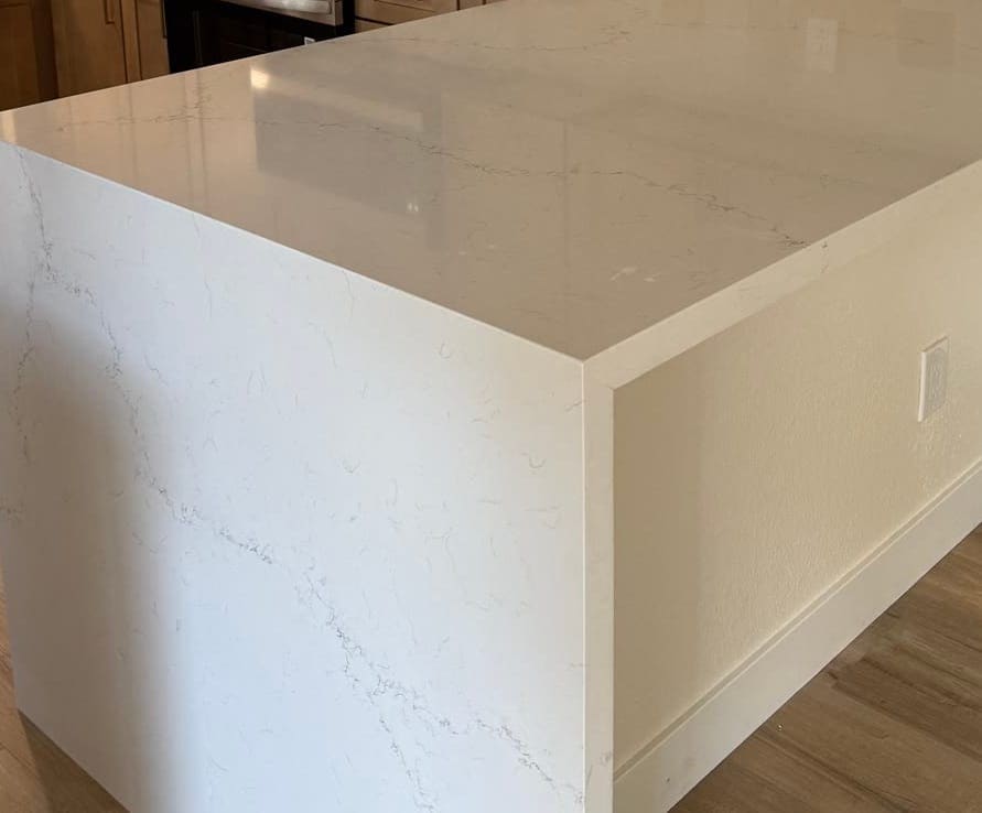 Mitred quartz corner where a peninsula top turns down into the waterfall panel