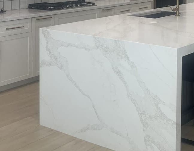 Marble waterfall edge on a custom kitchen island